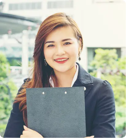young-business-woman-with-document-hand-front-building